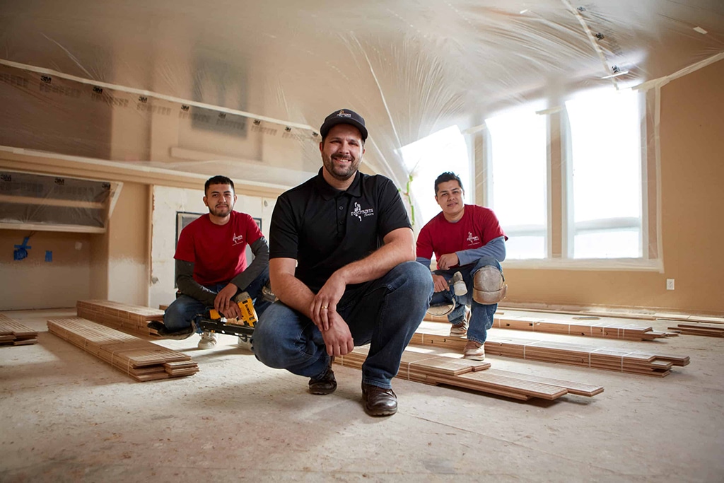 Workers of a flooring franchise